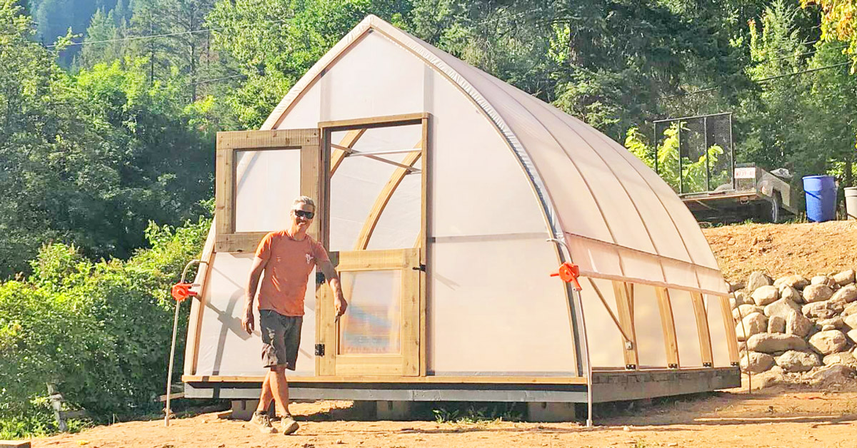 Stunning nasturtiums in full bloom in a beautiful Gothic Arch Greenhouse designed by Argenta Greenhouse Company. 